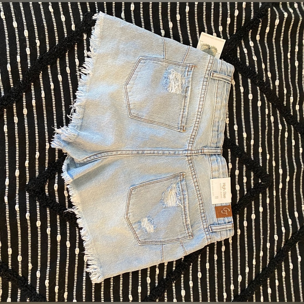 An exquisite pair of light wash distressed jean shorts